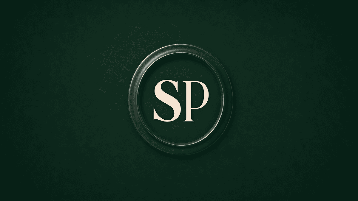 Storyline Pros circular monogram seal, cream SP letters in a ring on forest green.